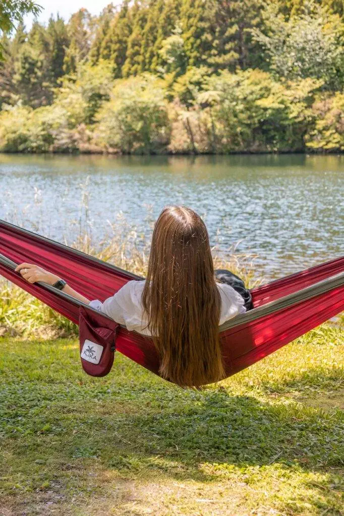 girl sitting in merlot coloured hammock